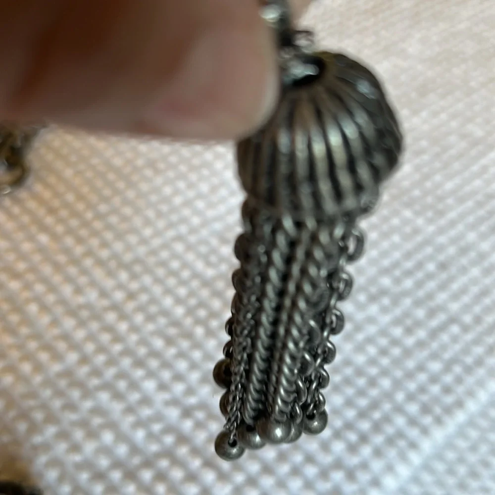 Women’s double chain belt. One of metal objects and the second chain of pearls.